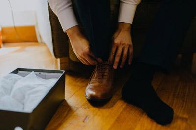 A picture of a man preparing to dress up